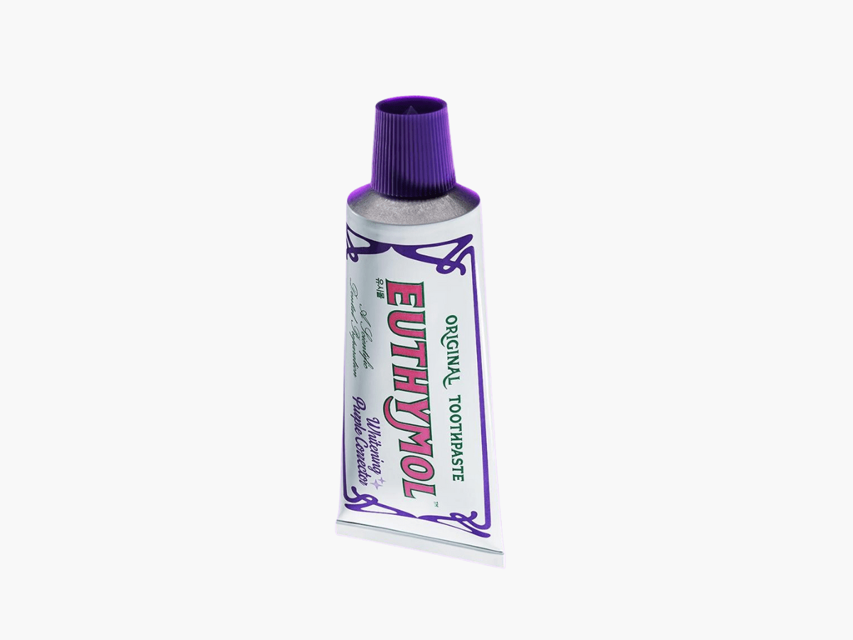 Euthymol Purple Whitening Toothpaste known for its unique antiseptic flavor and fluoride-free formula, designed to remove surface stains and keep teeth naturally bright.