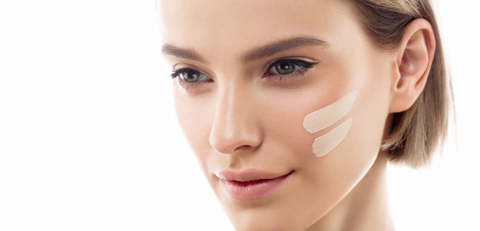 Close-up of a person's ear and part of a neck, with light, neutral background highlighting the features.