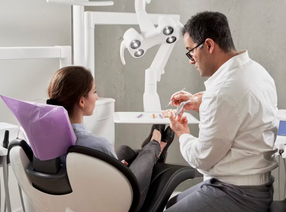 a woman meeting with her dentist.