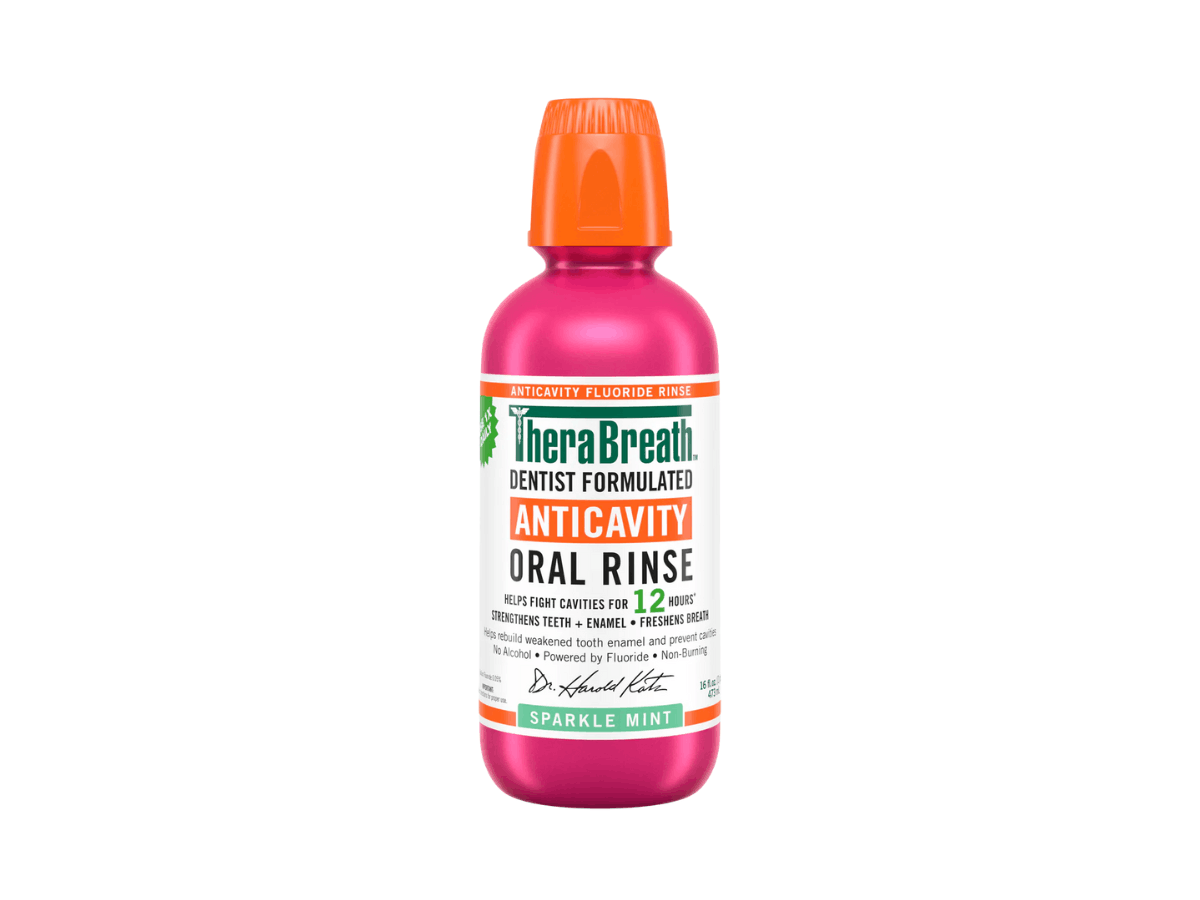 Bottle of TheraBreath dentist-formulated anticavity fluoride oral rinse in Sparkle Mint for cavity protection and fresh breath